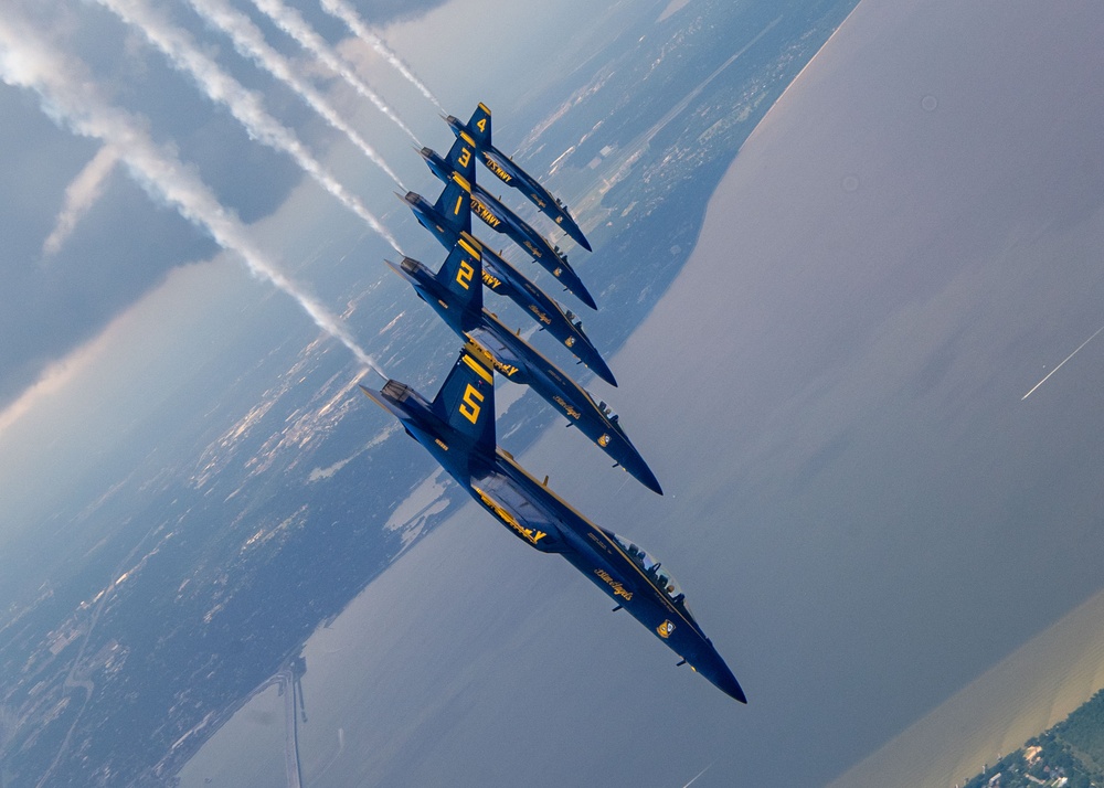 The Navy Flight Demonstration Squadron, the Blue Angels, perform in Pensacola Beach, FL.