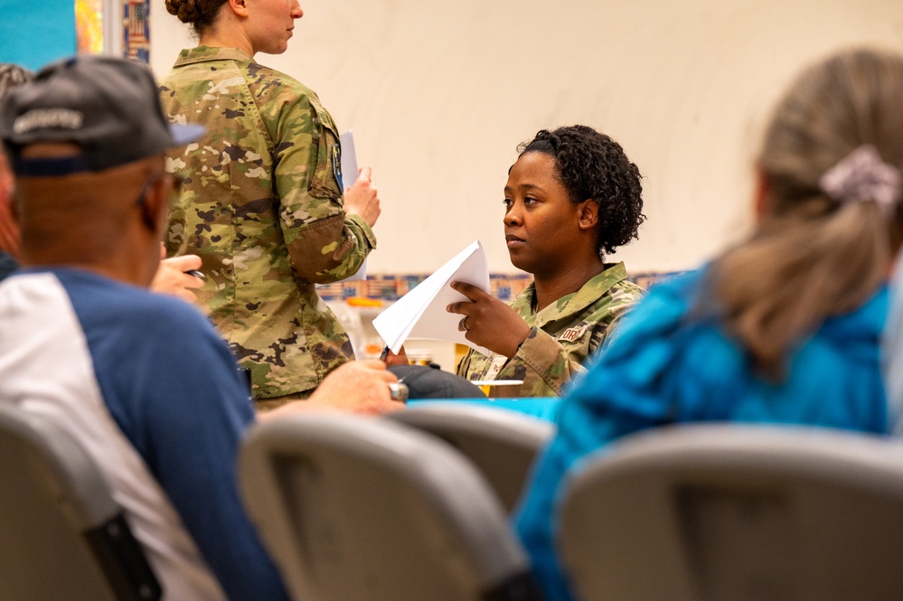 Space Base Delta 1 holds mass will signing at Peterson SFB