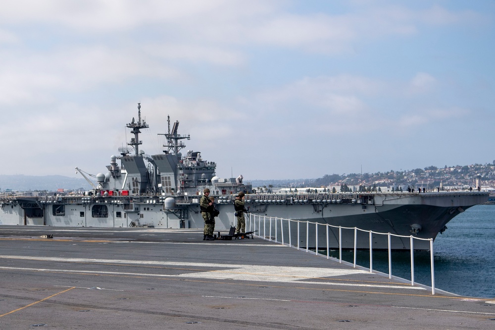 The USS Tripoli Sails Past Nimitz