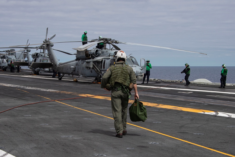 Capt. Pete Riebe participates in helicopter operations aboard Abraham Lincoln