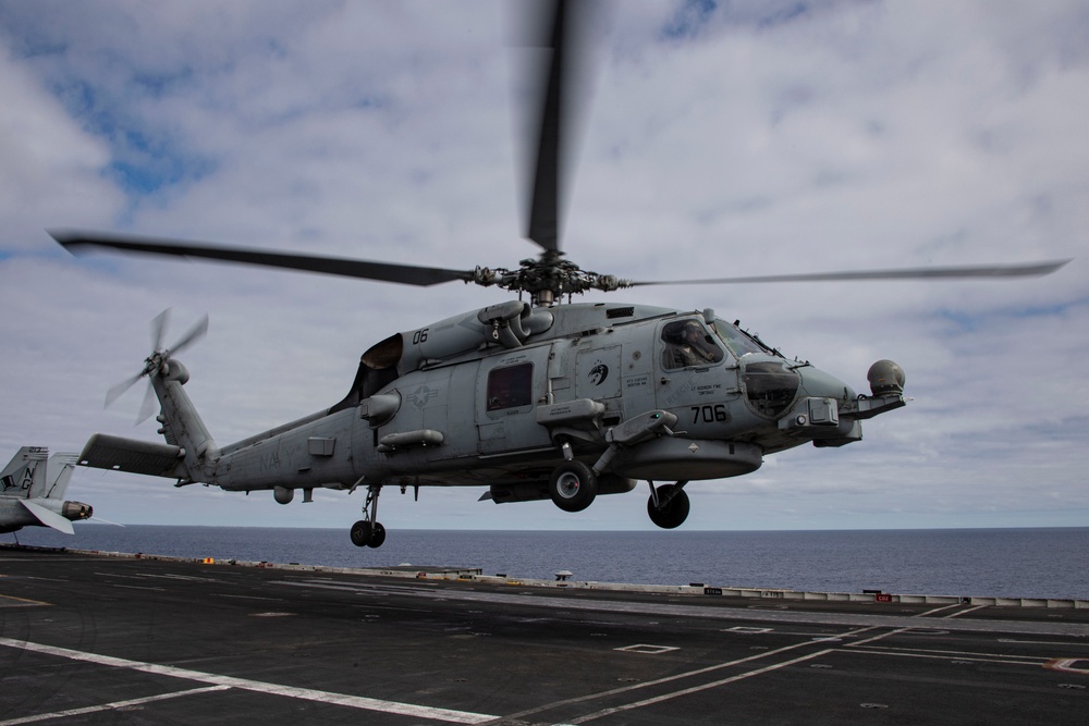 Capt. Pete Riebe participates in helicopter operations aboard Abraham Lincoln