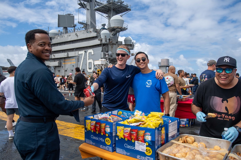 USS Ronald Reagan (CVN 76) holds a steel beach picnic for the 4th of July