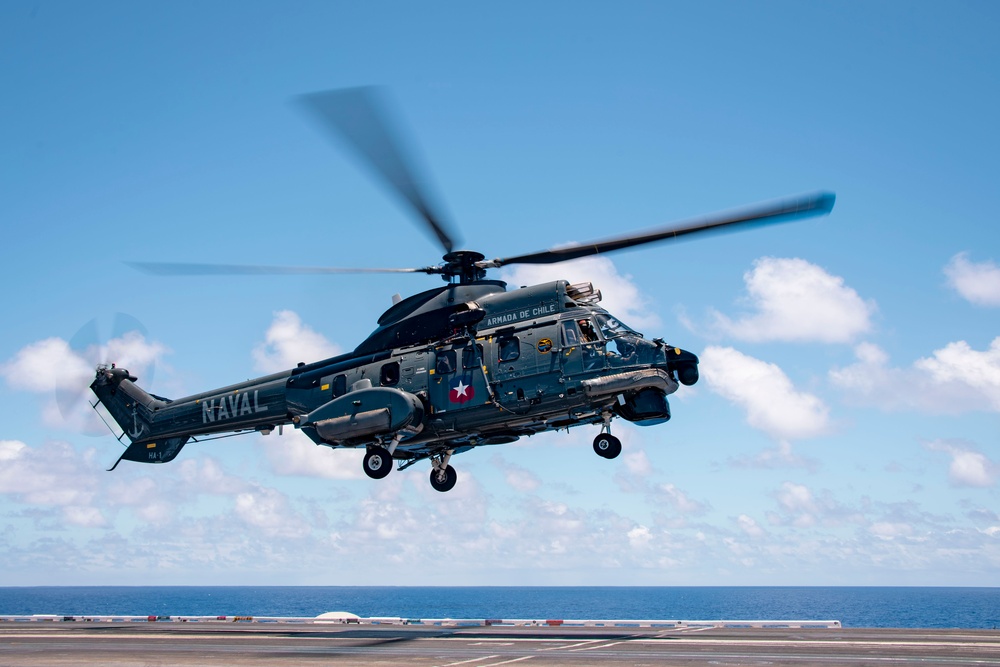 A Chilean Navy AS532 Cougar Eurocopter takes off from USS Carl Vinson (CVN 70)