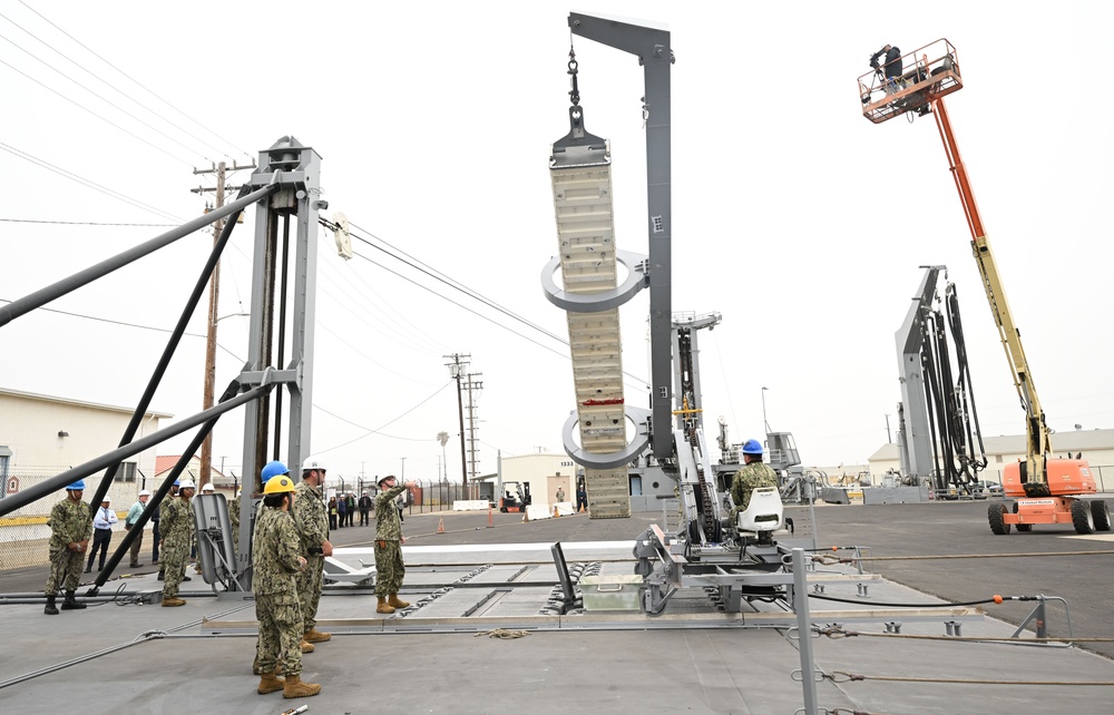 Naval Expeditionary Logistics Support Group and USS Chosin (CG 65) Guide a Missile Canister Using the U.S. Navy’s Transferrable Rearming Mechanism