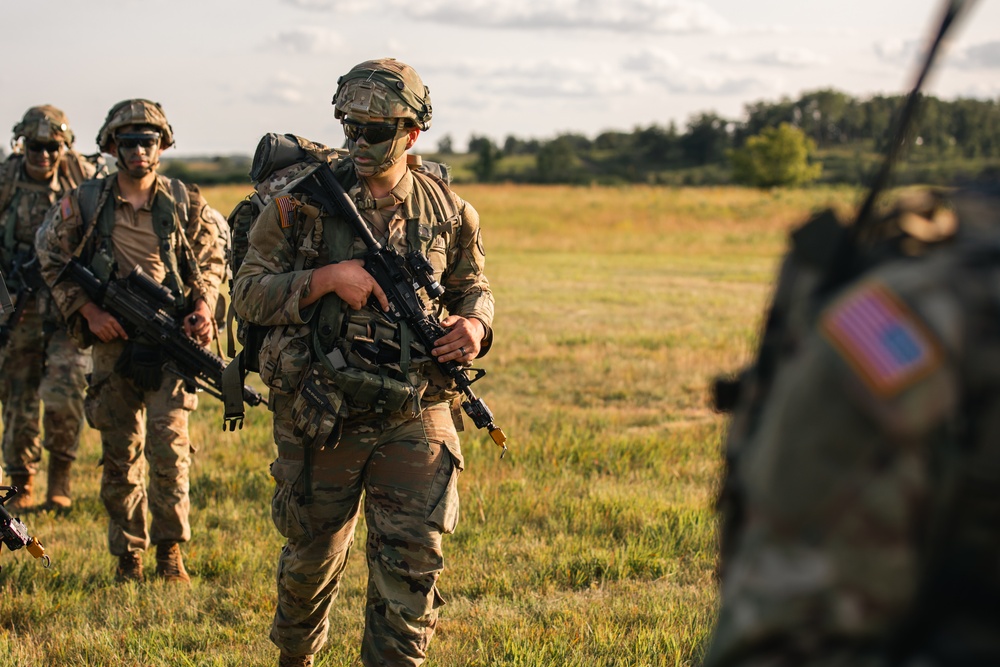 Iowa National Guard infantrymen move to rally point following air assault exercise.
