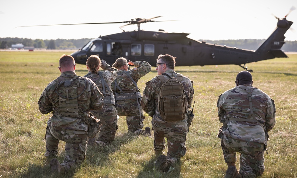 Iowa Soldiers wait to board Black Hawk during air assault exercise