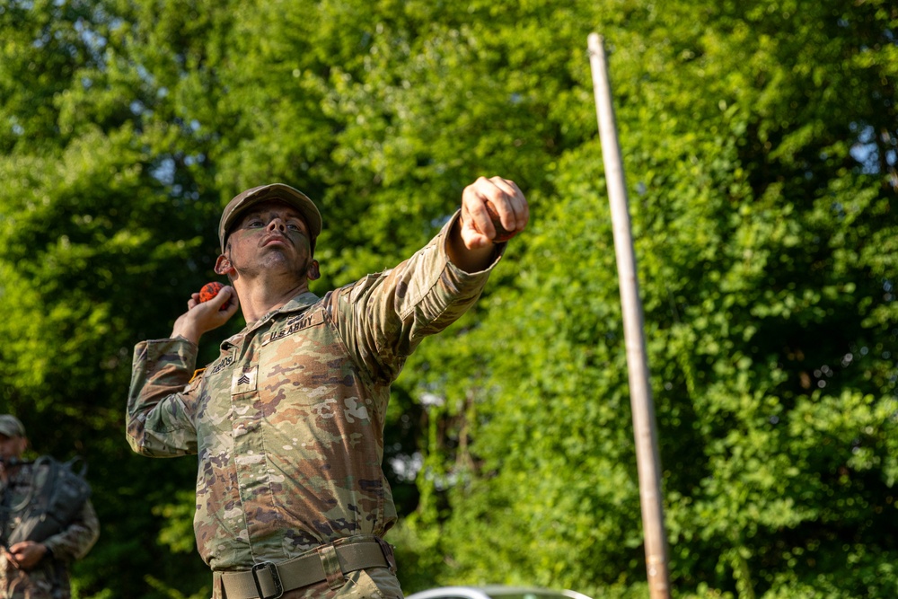 Sgt. Trenton Tuberosa throws a practice grenade