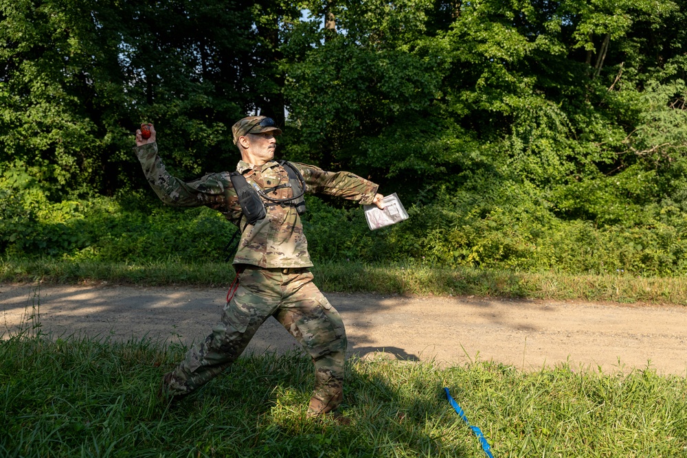 Lt. Col. Thomas Sebastiani throws a practice grenade