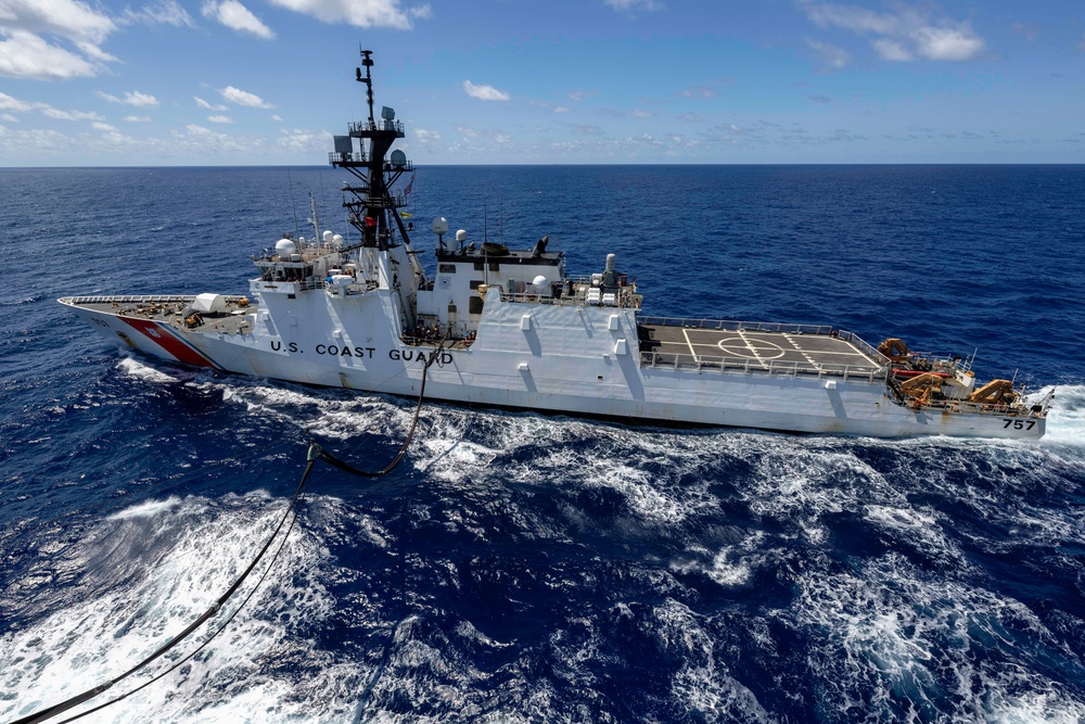 Replenishment at sea with MV Asterix, USCGC Midgett