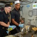 USS Ronald Reagan (CVN 76) Sailors prepare food