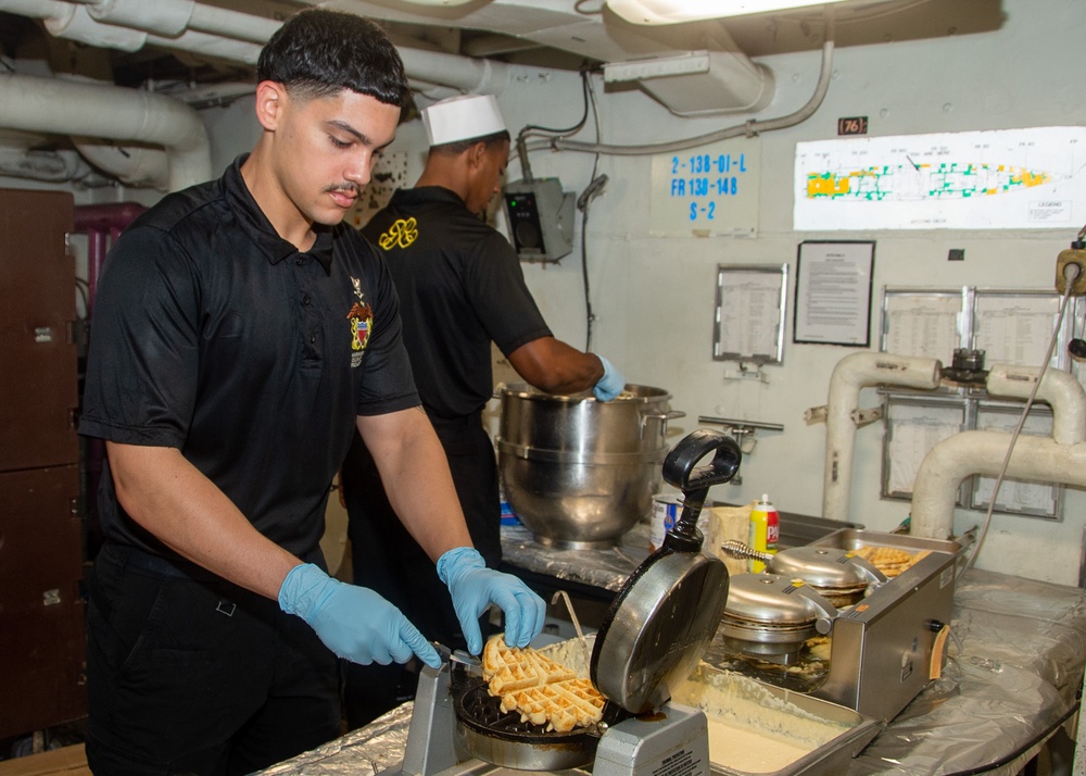 USS Ronald Reagan (CVN 76) Sailors prepare food