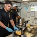 USS Ronald Reagan (CVN 76) Sailors prepare food
