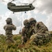 Two Iowa Army National Guard Soldiers smile for portrait following sling load exercise