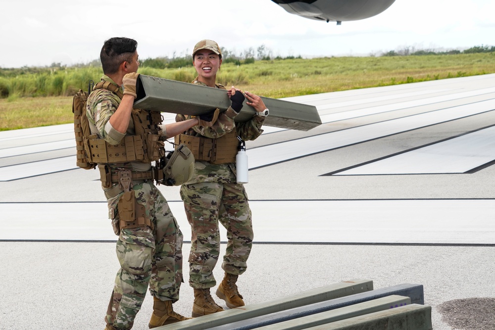 146CRT Airmen offload C-17 cargo, set up for command and control of Northwest Field, Guam