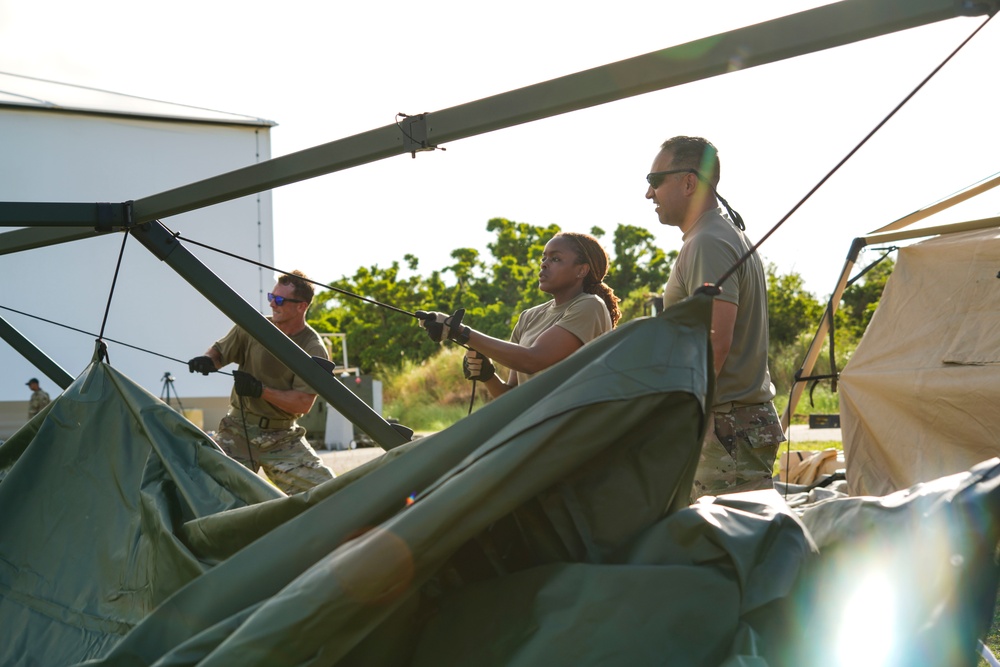 146CRT Airmen offload C-17 cargo, set up for command and control of Northwest Field, Guam