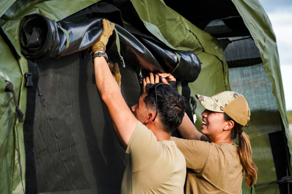 146CRT Airmen offload C-17 cargo, set up for command and control of Northwest Field, Guam