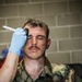 Special effects artist applies fake injuries to Iowa Soldier at XCTC