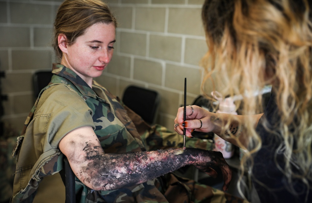 Special effects artist applies fake injuries to Iowa Soldier at XCTC