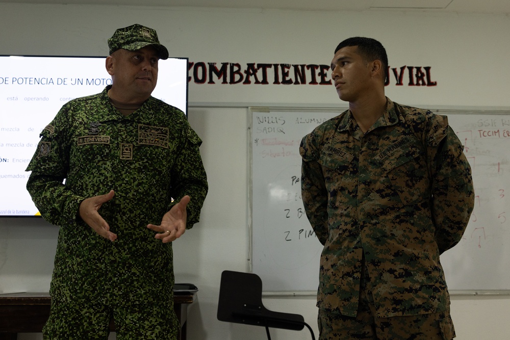 U.S. Marines with Littoral Craft Company Charlie learn about Colombian Marine Corps littoral crafts in a classroom setting.