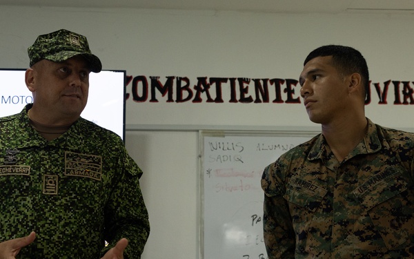 U.S. Marines with Littoral Craft Company Charlie learn about Colombian Marine Corps littoral crafts in a classroom setting.