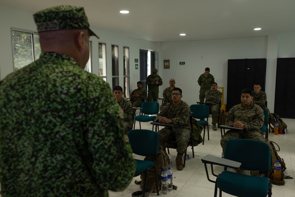 U.S. Marines with Littoral Craft Company Charlie learn about Colombian Marine Corps littoral crafts in a classroom setting.