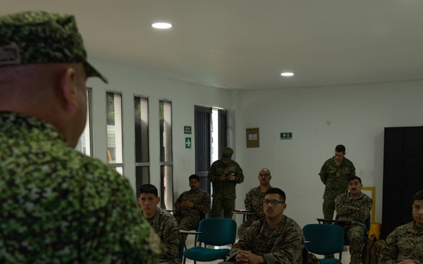 U.S. Marines with Littoral Craft Company Charlie learn about Colombian Marine Corps littoral crafts in a classroom setting.