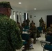 U.S. Marines with Littoral Craft Company Charlie learn about Colombian Marine Corps littoral crafts in a classroom setting.