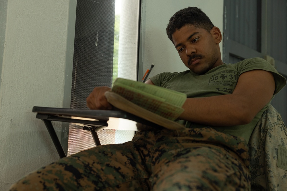 U.S. Marines with Littoral Craft Company Charlie learn about Colombian Marine Corps littoral crafts in a classroom setting.