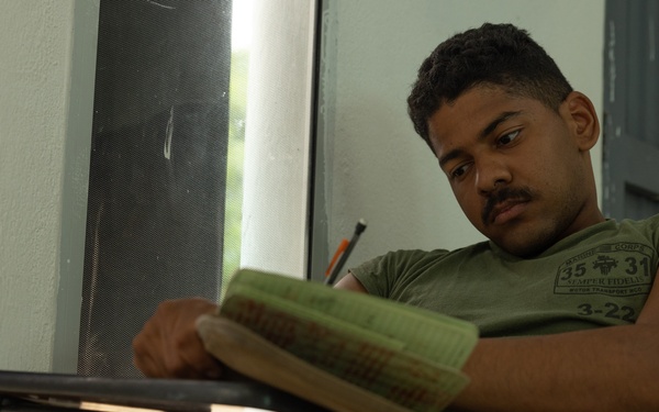 U.S. Marines with Littoral Craft Company Charlie learn about Colombian Marine Corps littoral crafts in a classroom setting.