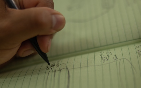 U.S. Marines with Littoral Craft Company Charlie learn about Colombian Marine Corps littoral crafts in a classroom setting.