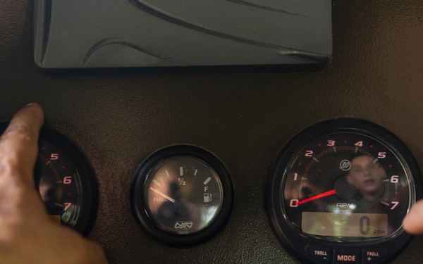 U.S. Marines with Littoral Craft Company Charlie learn about Colombian Marine Corps littoral crafts