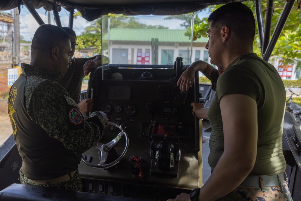 U.S. Marines with Littoral Craft Company Charlie learn about Colombian Marine Corps littoral crafts