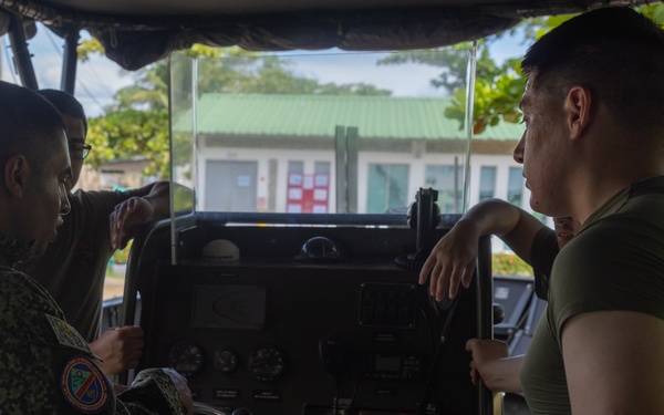 U.S. Marines with Littoral Craft Company Charlie learn about Colombian Marine Corps littoral crafts