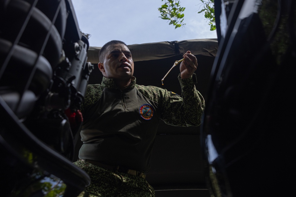 U.S. Marines with Littoral Craft Company Charlie learn about Colombian Marine Corps littoral crafts