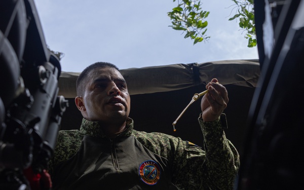 U.S. Marines with Littoral Craft Company Charlie learn about Colombian Marine Corps littoral crafts