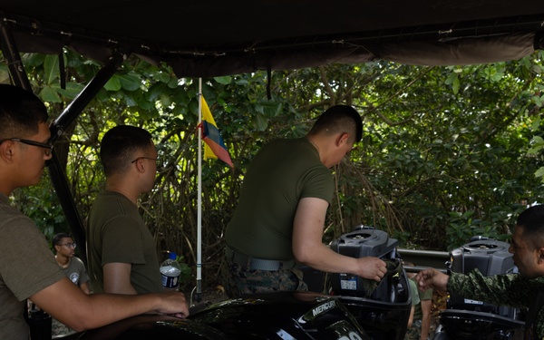U.S. Marines with Littoral Craft Company Charlie learn about Colombian Marine Corps littoral crafts