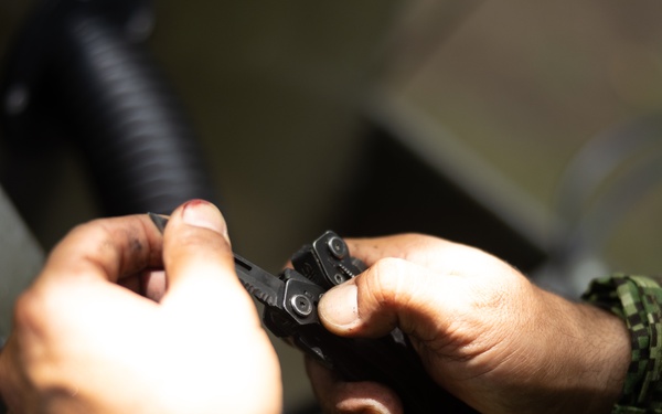 U.S. Marines with Littoral Craft Company Charlie learn about Colombian Marine Corps littoral crafts