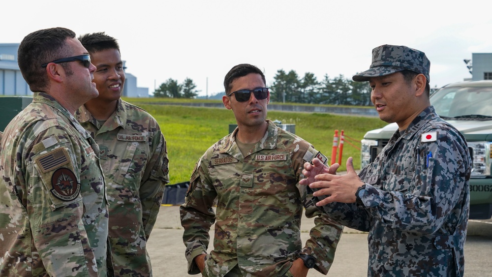 JASDF CR &amp; 146 CRT assist each other setting up equipment