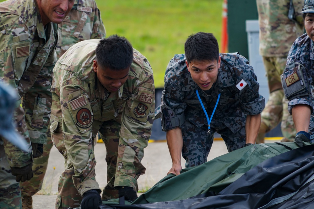 JASDF CR &amp; 146 CRT assist each other setting up equipment