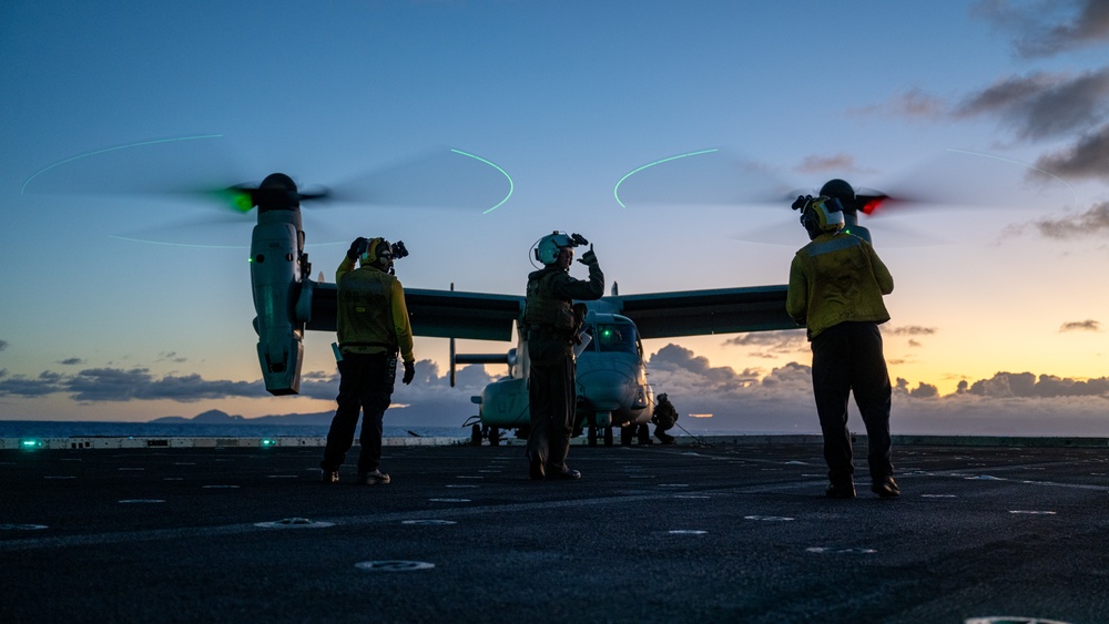 MV-22B Osprey pilot signals for fuel aboard USS Somerset