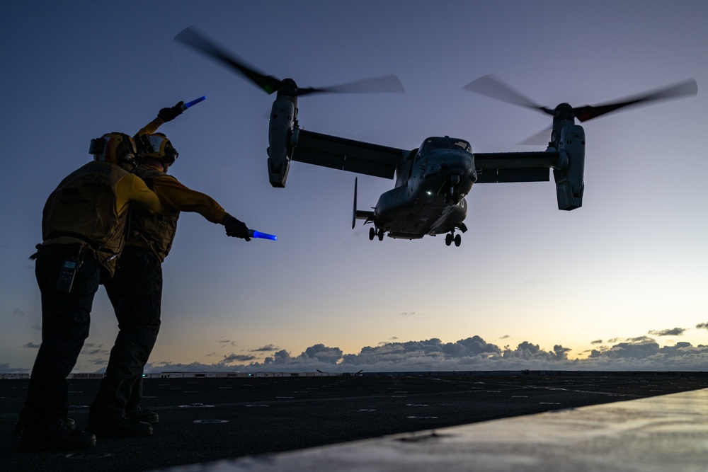 Aviation Boatswain’s Mate (Handling) signals to MV-22B Osprey