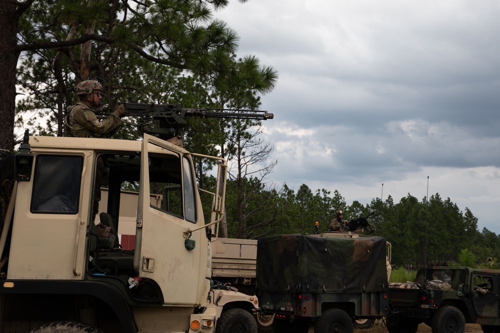 U.S. Army Spc. provides security for convoy departure.