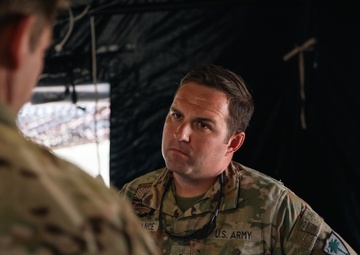Apache helicopter pilot studies mission briefing information before exercise