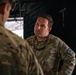 Apache helicopter pilot studies mission briefing information before exercise
