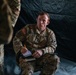 Apache helicopter pilot studies mission briefing information before exercise