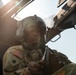 Apache helicopter pilot prepares cockpit prior to mission