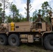 Wrecker operator controls winch during recovery operation
