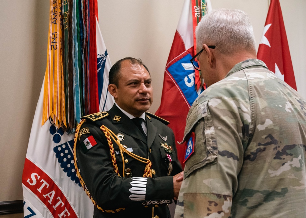 Army North Commanding General presents Mexican liason with the Meritorious Service Medal