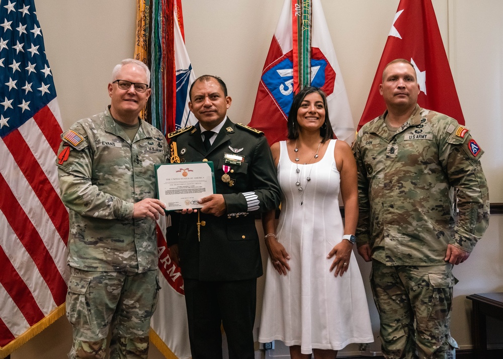 Army North Commanding General presents Mexican liason with the Meritorious Service Medal