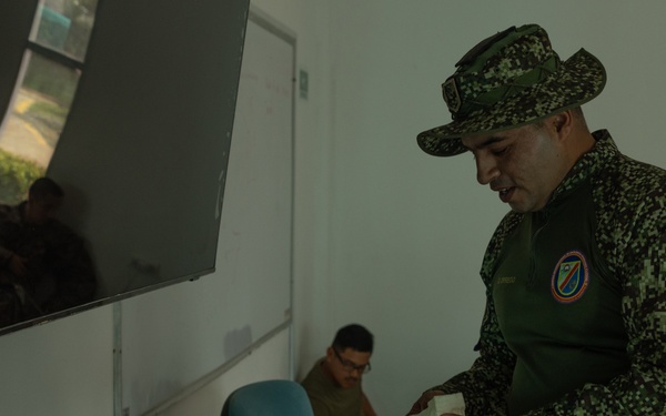 U.S. Marines with Littoral Craft Company Charlie, eat jackfruit with their Colombian Marine Corps Instructor